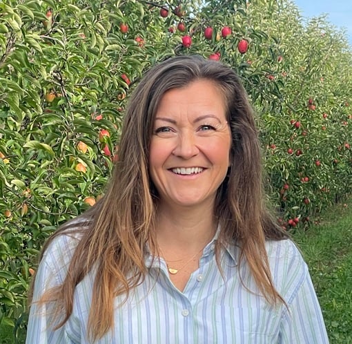 Hannah Isichei Pr and Marketing manager in apple orchard
